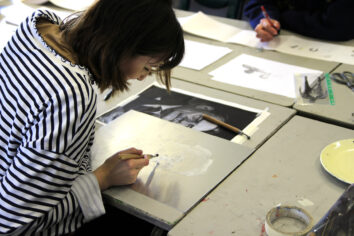 Art&design00013 A photo of a student working on a piece of artwork.