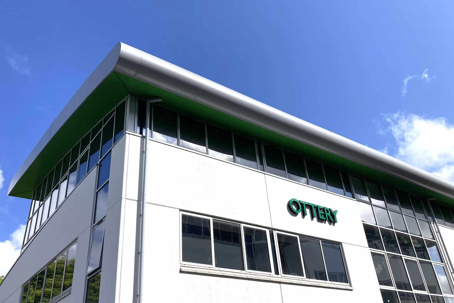 An image of a corner of the STEM and Health Skills Centre in Bodmin, Cornwall with blue sky and white clouds.