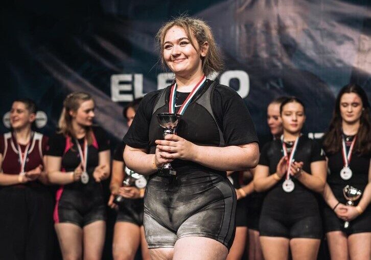 Ami, sport student, collecting an award. Ami, sport student, collecting an award.